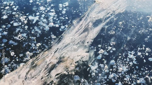 Wallpaper Mural Transparent blue ice with cracks and bubbles on the frozen lake. Texture of ice close up. Abstract winter nature background.
 Torontodigital.ca
