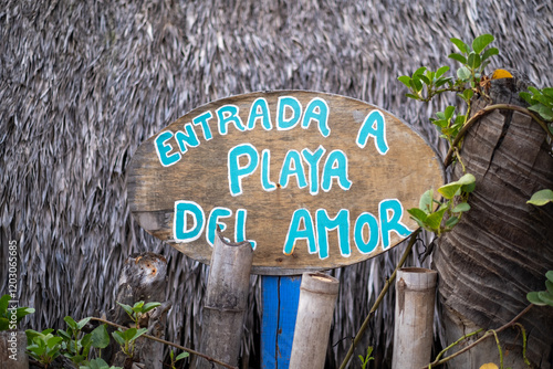 A sign readinf Entrada a Playa del Amor (Entry to the Beach of Love) at Playa Zipolite, a nudist beach popular with the LGBT community, in Zipolite, Oaxaca, Mexico. photo