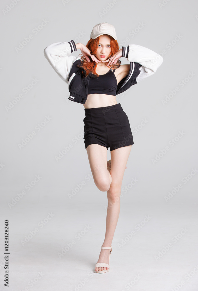 Full body portrait of asian beautiful sexy cheerful confident young woman with long orange hair model wearing fashionable black outfit cap, standing pose looking camera on white background in studio. Full body portrait of asian beautiful sexy cheerful confident young woman with long orange hair model wearing fashionable black outfit cap, standing pose looking camera on white background in studio.