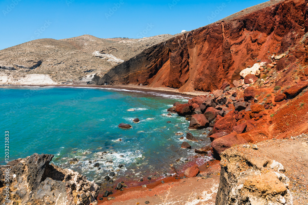 Red beach in Santorini island, Greece. Red volcanic cliffs and the blue sea at sunny day.
