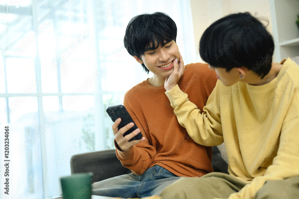 Affectionate gay couple relaxing together at home Affectionate gay couple relaxing together at home