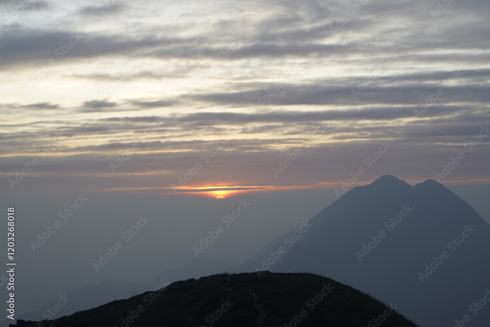 Hiking in the mountains watch the sunset Hiking in the mountains watch the sunset