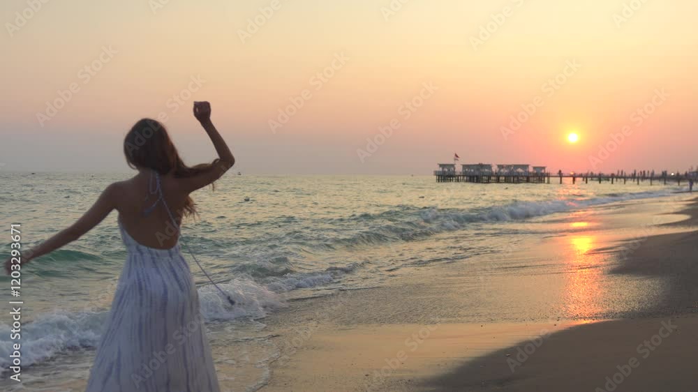A graceful girl twirling in dance on a sandy beach at sunset, surrounded by warm golden light and serene ocean waves, capturing beauty and joy. A graceful girl twirling in dance on a sandy beach at sunset, surrounded by warm golden light and serene ocean waves, capturing beauty and joy.