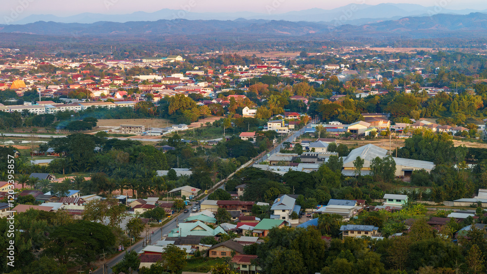 The cityscape in the photo, captured from a high angle, shows a large number of houses. This view would be perfect for creating a background image. The cityscape in the photo, captured from a high angle, shows a large number of houses. This view would be perfect for creating a background image.
