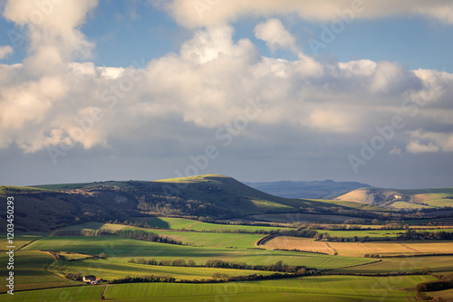 The wonderful views from Wilmington hill of the south downs towards Firle and Lewes east Sussex south east England UK photo