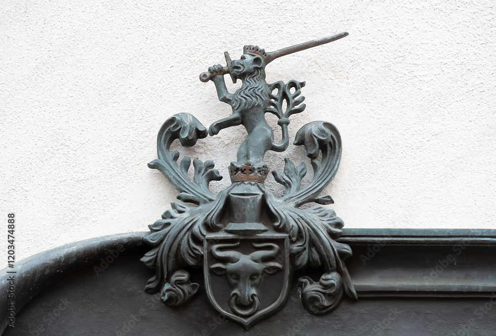 custom made wallpaper toronto digitalOld polish coat of arms with crowned lion with sword and bull head on the wall in Poland