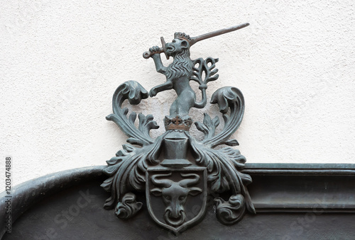 Wallpaper Mural Old polish coat of arms with crowned lion with sword and bull head on the wall in Poland Torontodigital.ca