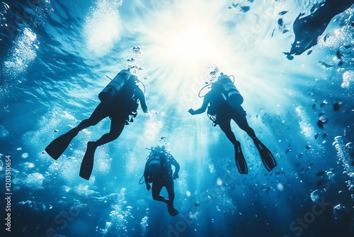Wallpaper Mural Three scuba divers explore a sunlit ocean, creating a breathtaking underwater scene. Perfect for adventure, travel, and diving themes. Torontodigital.ca