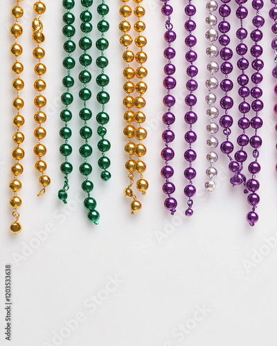 Mardi gras background on white with purple, yellow, green beads copy space for text. Banner. photo