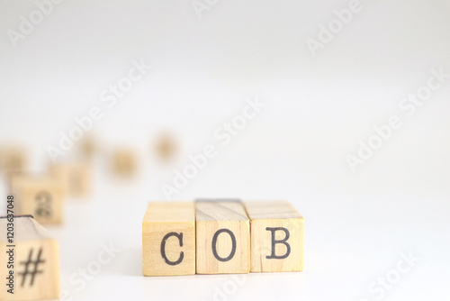 Wallpaper Mural Close of Business acronym. COB written on wooden cubes isolated on white background with space for text Torontodigital.ca