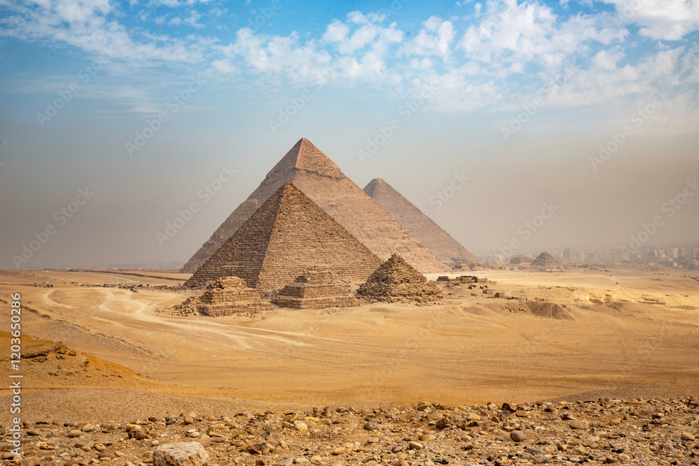 Egypt. Cairo - Giza. General view of pyramids from the Giza Plateau (three pyramids known as Queens' Pyramids on front side; next in order from left: the Pyramid of Menkaure, Khafre and Chufu Egypt. Cairo - Giza. General view of pyramids from the Giza Plateau (three pyramids known as Queens' Pyramids on front side; next in order from left: the Pyramid of Menkaure, Khafre and Chufu