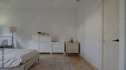 Modern bedroom interior with minimalistic furniture, clean lines, and a calming color palette for a serene environment.