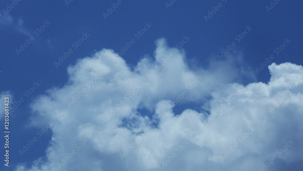 White clouds scattered in the blue sky White clouds scattered in the blue sky