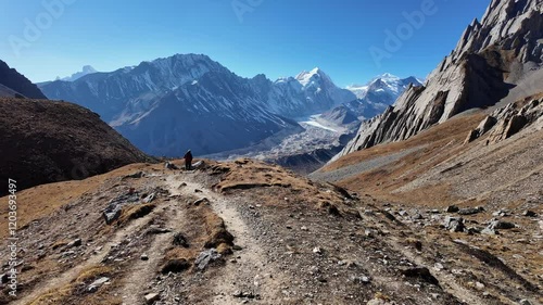 Manaslu Circuit, Nepal: Point of view of a trekker hiking back from the Chinese Tibet border pass at the Rui La pass, near Samdo village on a clear winter day in the Himalaya in Nepal. 
