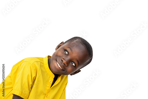 Young boy in a yellow shirt leaning playfully, his curious expression and sparkling eyes radiating youthful energy and charm. Isolated on a transparent background photo