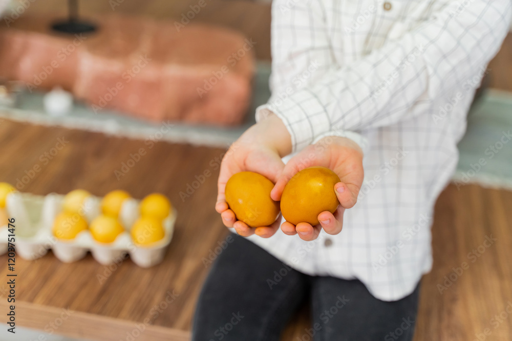 The boy is holding Easter eggs in his hands. The concept of Easter, Christianity, family The boy is holding Easter eggs in his hands. The concept of Easter, Christianity, family
