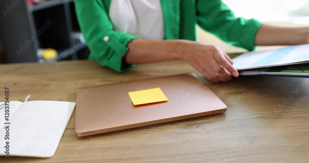 A tranquil workspace with a laptop and a bright Postit note, ideal for boosting productivity and organization A tranquil workspace with a laptop and a bright Postit note, ideal for boosting productivity and organization