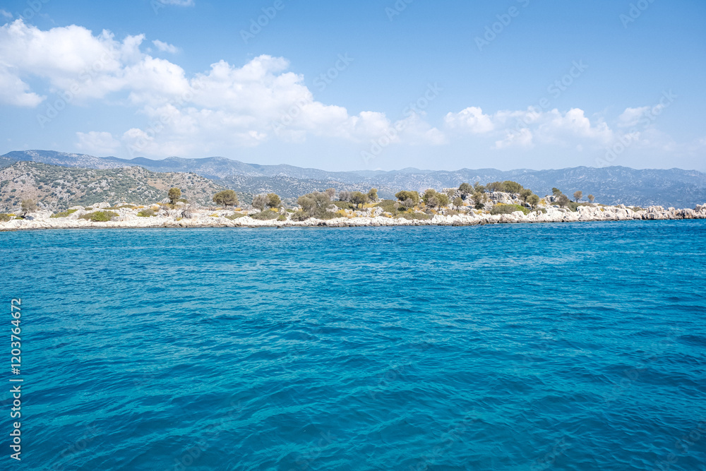 Fototapeta premium Beautiful bay near Kekova island and Kas in Antalya province, Turkiye. Sunny summer in seaside. Turquoise water.