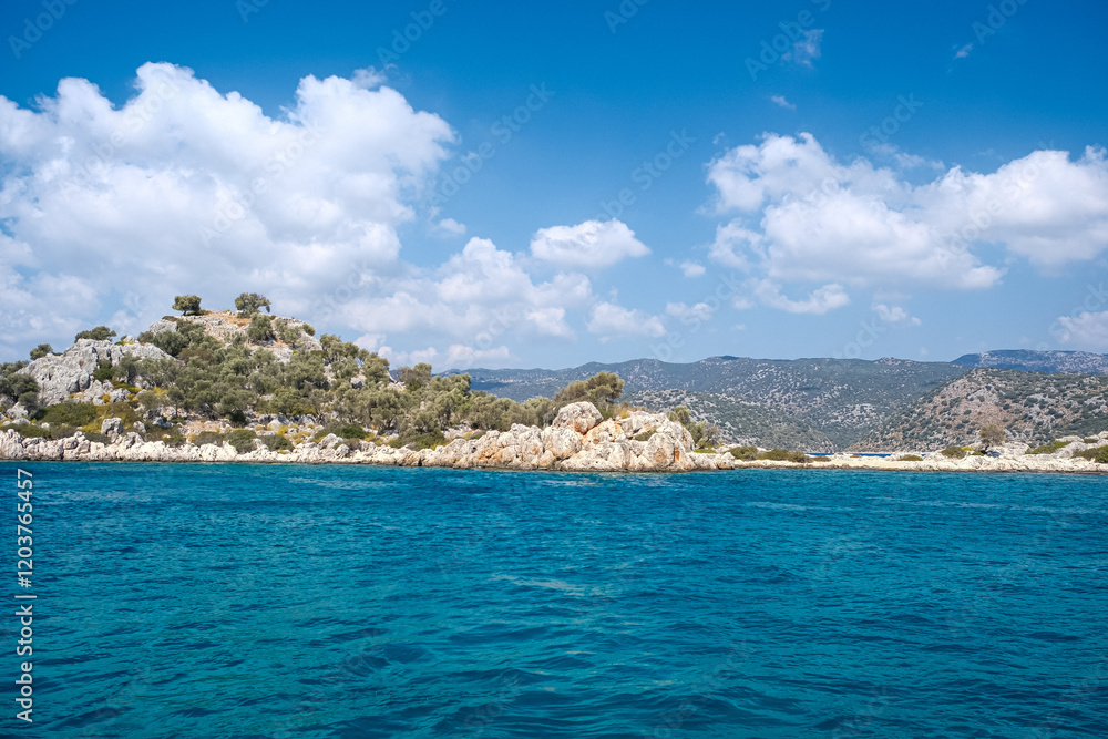Beautiful bay near Kekova island and Kas in Antalya province, Turkiye. Sunny summer in seaside. Turquoise water. Beautiful bay near Kekova island and Kas in Antalya province, Turkiye. Sunny summer in seaside. Turquoise water.