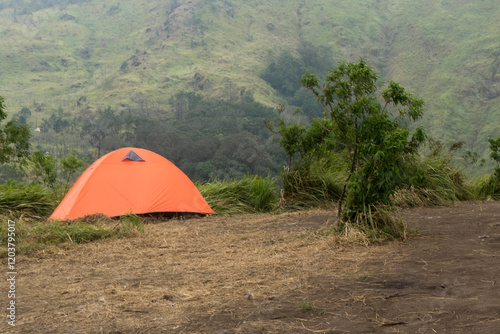 Outdoors travel concept background of tent in the mountains