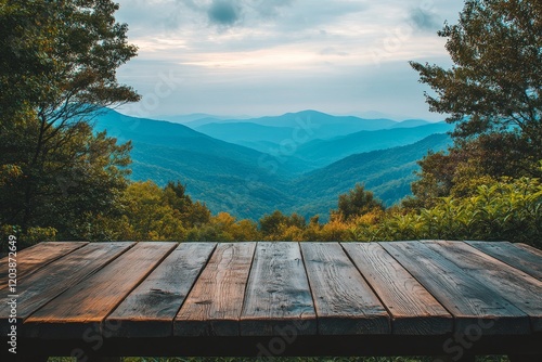 Serene mountain view from a wooden deck during twilight in a lush green lands...