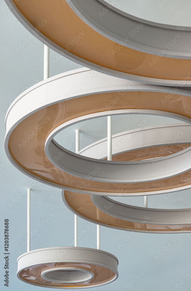 Architecture and interior design round lights on ceiling. The Rounded ceiling mounted light fixtures with modern LED light bulb, The circular ring shaped lamps hang under ceiling, Space for text.