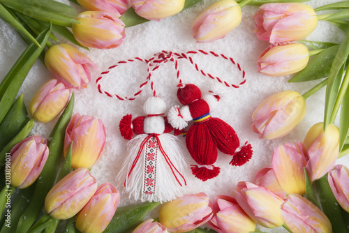Fotografi Martenitsa, Martisor, on snow framed with pink tulips
