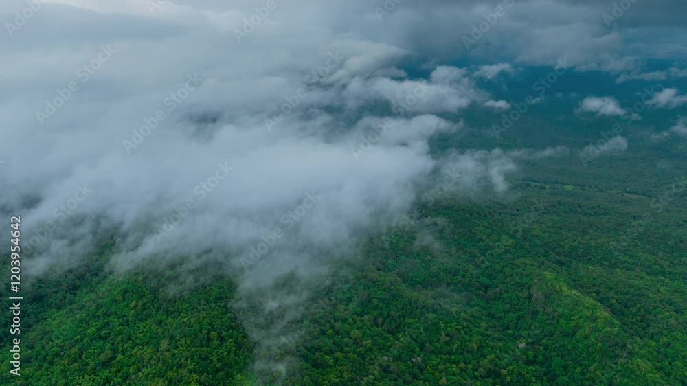 Aerial view of a beautiful landscape in northern Thailand, captured in a 4K hyperlapse video featuring white fog or clouds moving over the green forest below.
Aerial view of a beautiful landscape in northern Thailand, captured in a 4K hyperlapse video featuring white fog or clouds moving over the green forest below.