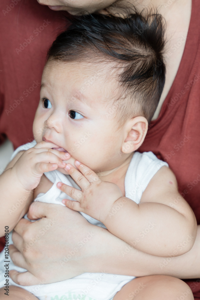 a woman holding a baby in her arms a woman holding a baby in her arms