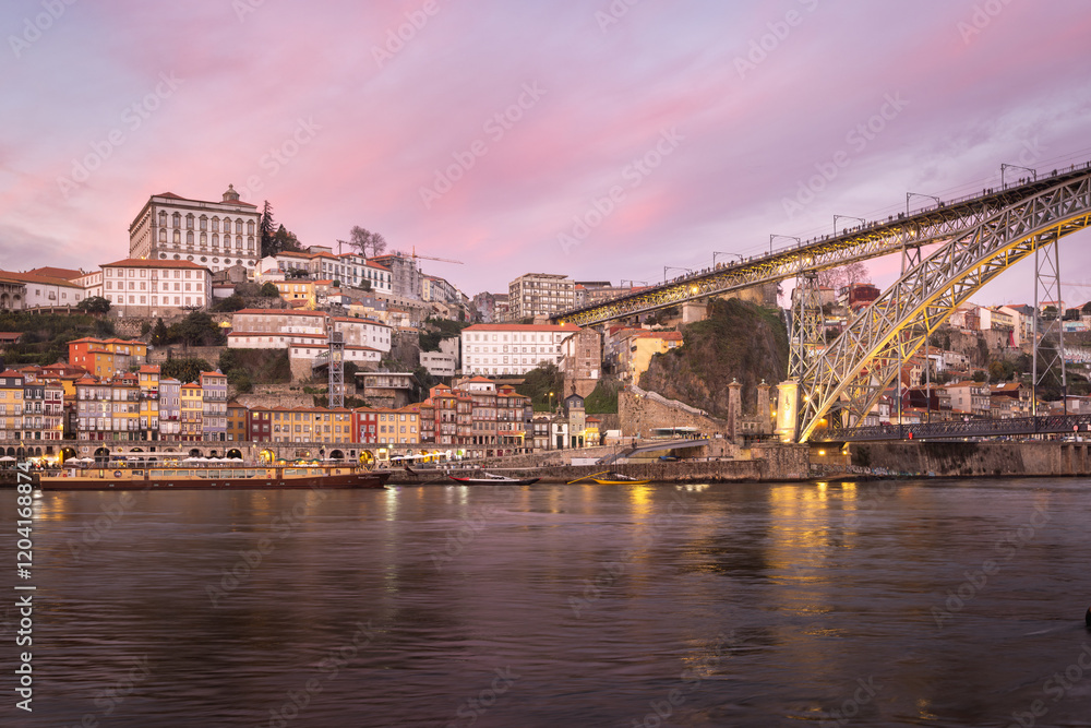 Fototapeta premium Porto (Portugal) and its beautiful and picturesque historical architecture of ancient Europe. Colorful buildings of the Portuguese city at sunset