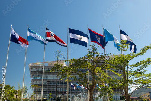 Waving flags of the seven Central American countries - Belize, Costa Rica, El Salvador, Guatemala, Honduras, Nicaragua, and Panama at  Jardin Centroamerica in downtown of San Salvador, El Salvador. photo