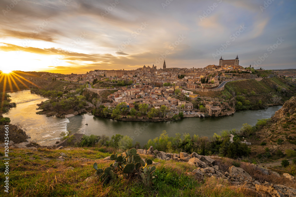 Toledo aerial panoramic skyline view of the historic city center, Old Town with Tagus River, churches, cathedral, museums, ancient city walls and squares. Toledo, Spain panorama cityscape at sunrise. Toledo aerial panoramic skyline view of the historic city center, Old Town with Tagus River, churches, cathedral, museums, ancient city walls and squares. Toledo, Spain panorama cityscape at sunrise.