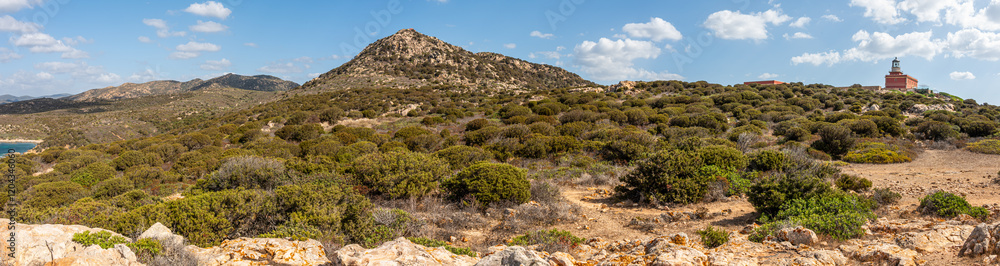 Landscape of the hinterland of Sardinia with the red lighthouse of Capo Spargivento