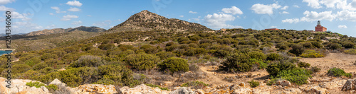 Obraz na płótnie Landscape of the hinterland of Sardinia with the red lighthouse of Capo Spargivento w salonie