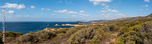 Obraz na płótnie Landscape of the south-west coast of Sardinia with cliffs, blue sea, fjords and white clouds w salonie