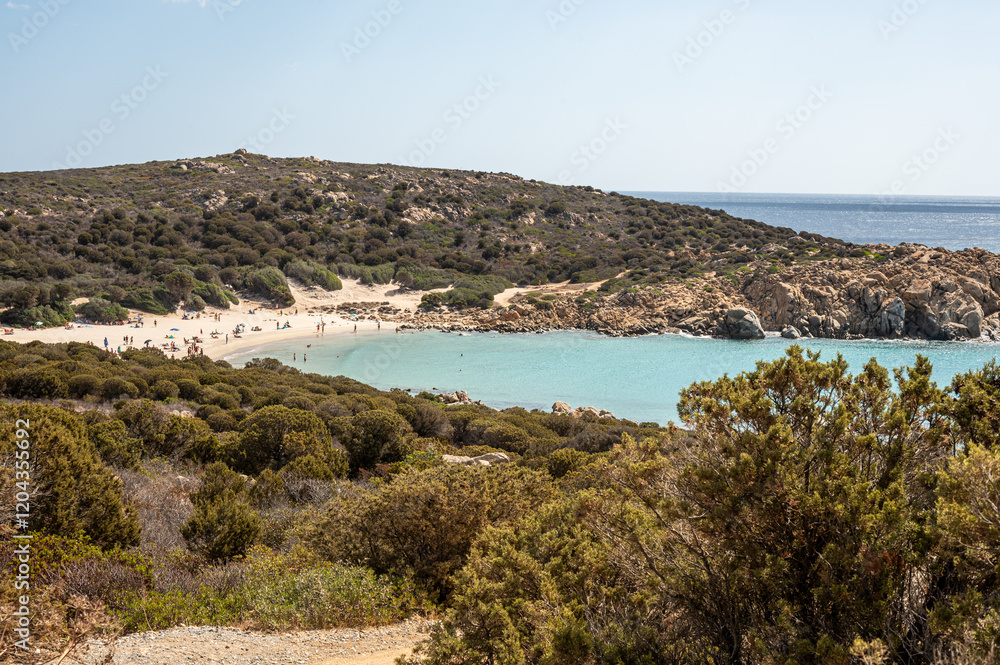 The beautiful beach of Cala Cipolla in Chia in Sardinia, with white sand and transparent and turquoise water