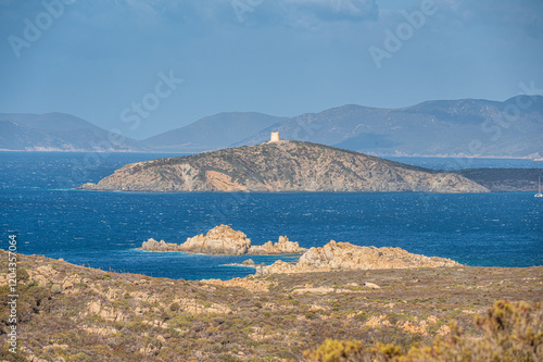 Landscape of the south-west coast of Sardinia with cliffs, blue sea, fjords and white clouds