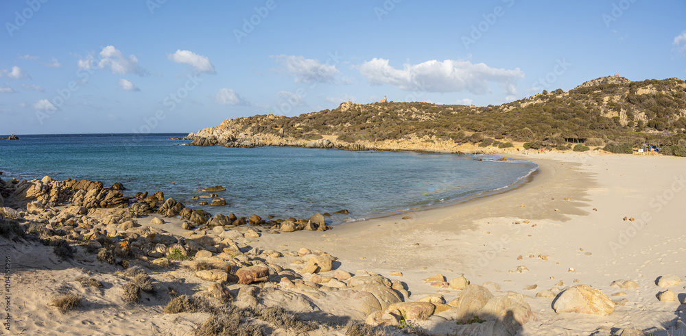 The beautiful beach of Cala Cipolla in Chia in Sardinia, with white sand and transparent and turquoise water