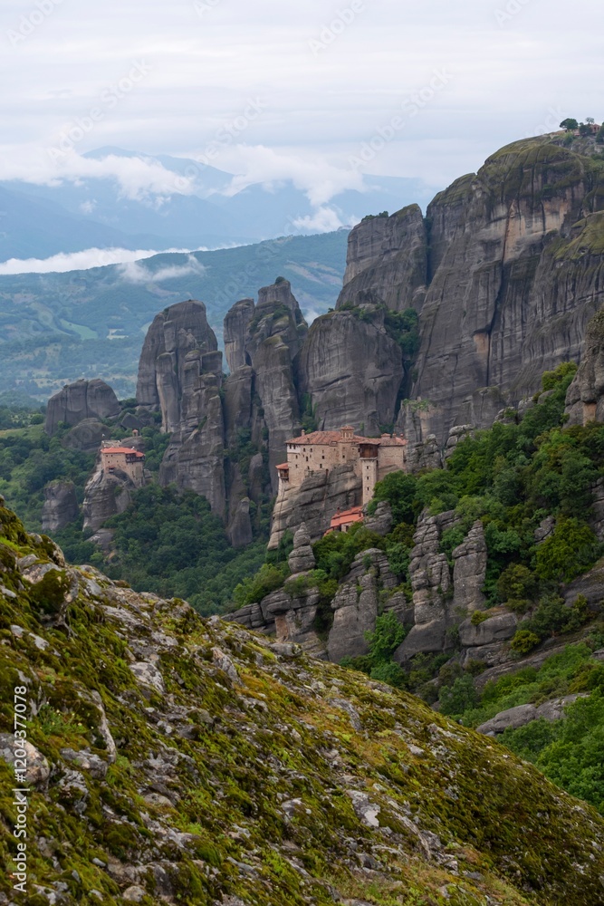 Meteora monasteries on the top of a mountain in the morning fog in Kalambaka Greece. Meteora monasteries on the top of a mountain in the morning fog in Kalambaka Greece.