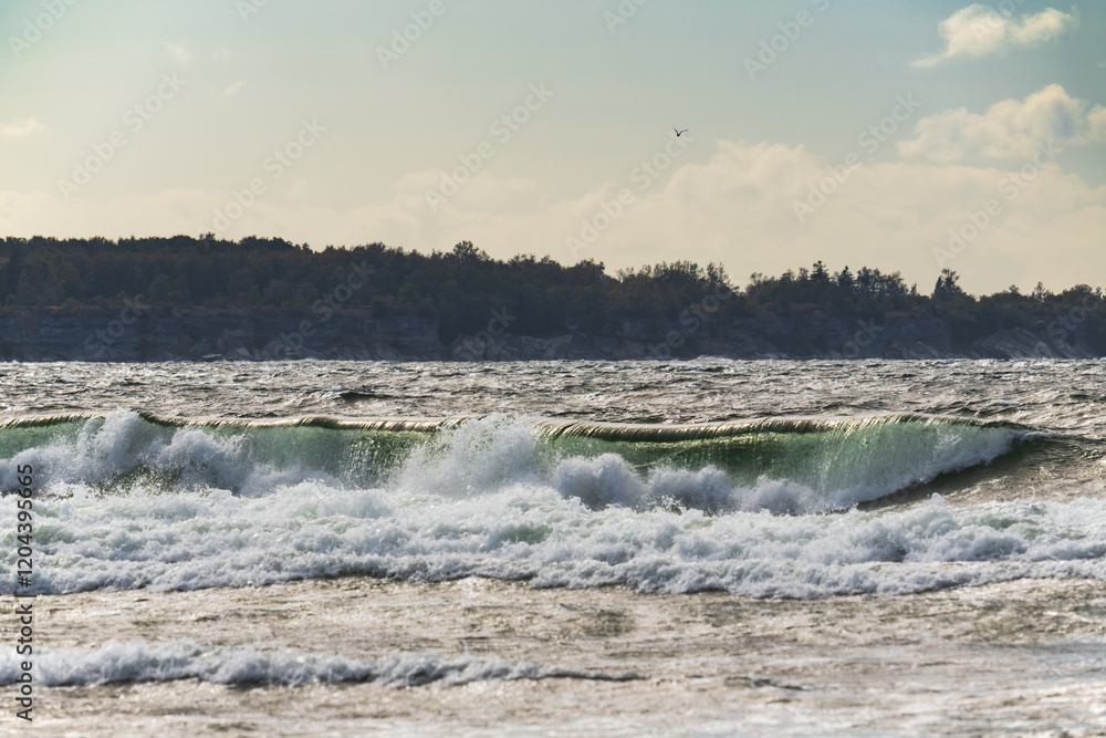 Turbulent waves crash ashore: a view of Estonia's Pakri Island from mainland Paldiski, a popular birdwatching destination. Turbulent waves crash ashore: a view of Estonia's Pakri Island from mainland Paldiski, a popular birdwatching destination.