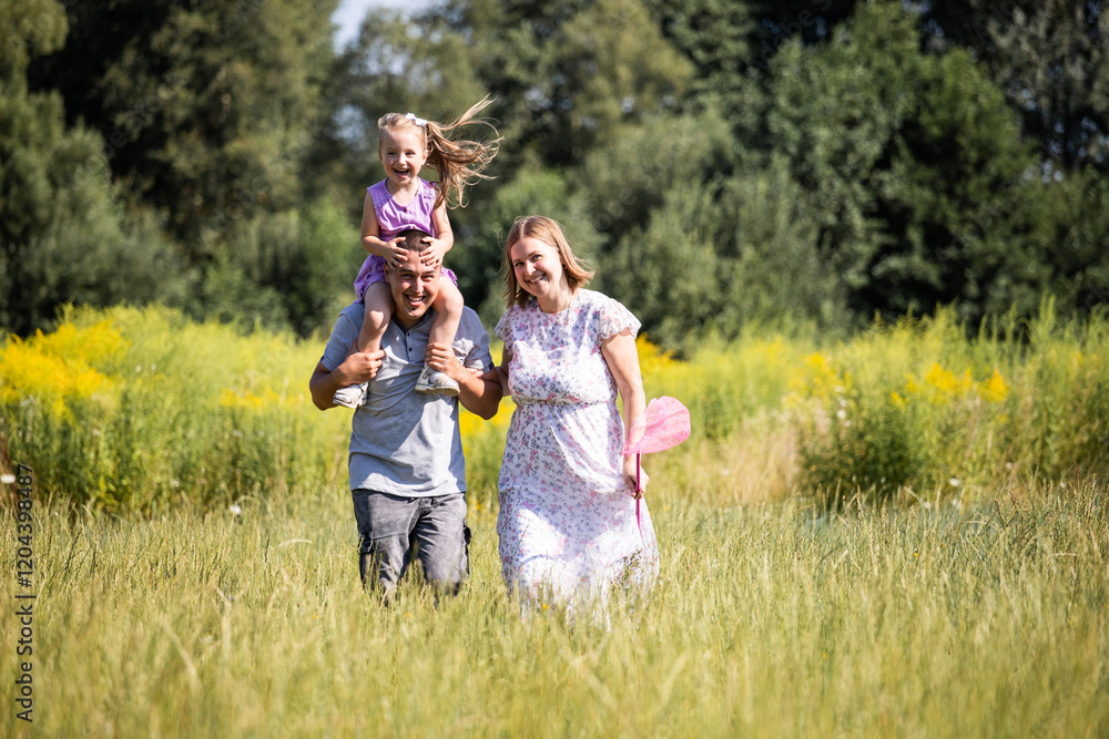 Parent and child. Happy family. Mom, dad and child relaxing in nature. Family in the park. Family having fun. Daughter Parent and child. Happy family. Mom, dad and child relaxing in nature. Family in the park. Family having fun. Daughter