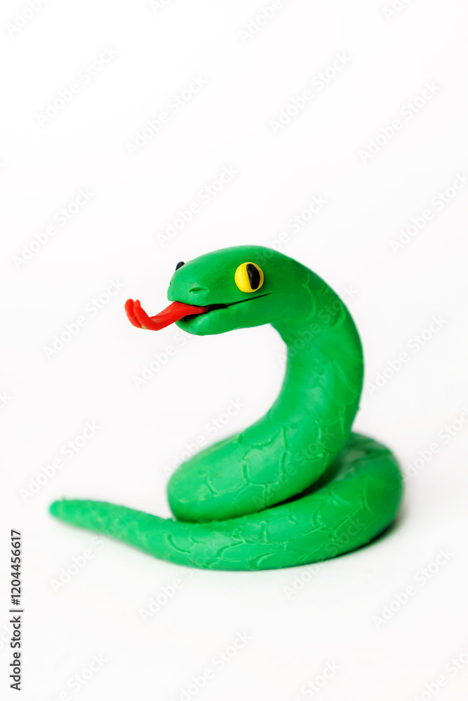 Obraz premium green plasticine snake on white background.