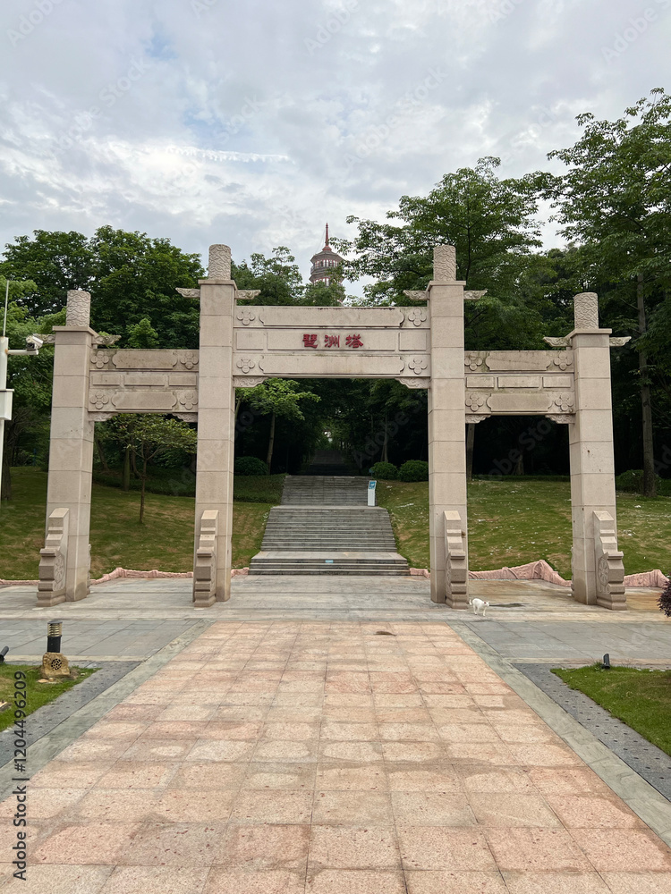 Architectural photograph of a traditional Chinese gate in a park. The image captures the serene beauty of the garden, with the imposing gate as the focal point. Architectural photograph of a traditional Chinese gate in a park. The image captures the serene beauty of the garden, with the imposing gate as the focal point.