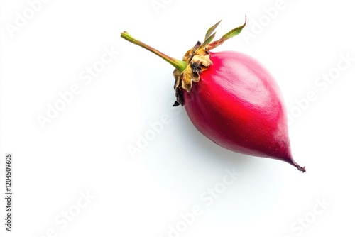A close-up shot of a bright red fruit on a clean white surface