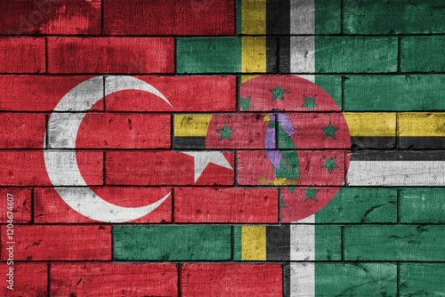 colourful painted big flag of turkey and flag of dominica on a massive old brick wall background. concept photo