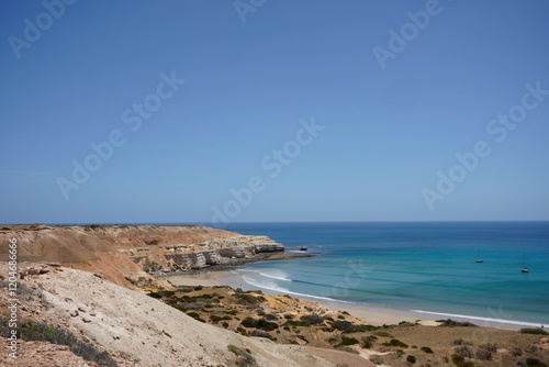 Scenic beach cliffs on South Australian coastal area. Maslin Beach, Pt Willunga area with waves. Artwork with artistic tones. photo