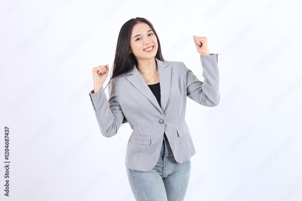 Beautiful woman in a gray jacket and jeans is smiling and clenched fists up Business asian woman Beautiful woman in a gray jacket and jeans is smiling and clenched fists up Business asian woman