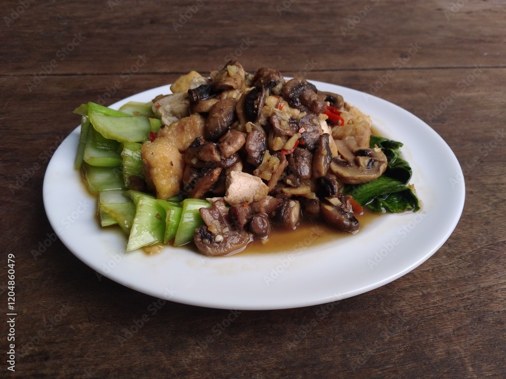 stir fry mushrooms with green mustard and egg as garnish stir fry mushrooms with green mustard and egg as garnish