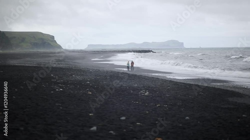 Scenic view of Reynisfjara black sand beach near Vik in Southern Iceland.