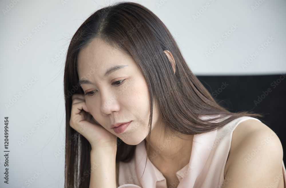 Worried, sad, tired, exhausted middle aged Asian woman with insomnia, concept image for Mental Stress, Sickness, frustration, life problem, depression, stress management for businesswoman Worried, sad, tired, exhausted middle aged Asian woman with insomnia, concept image for Mental Stress, Sickness, frustration, life problem, depression, stress management for businesswoman
